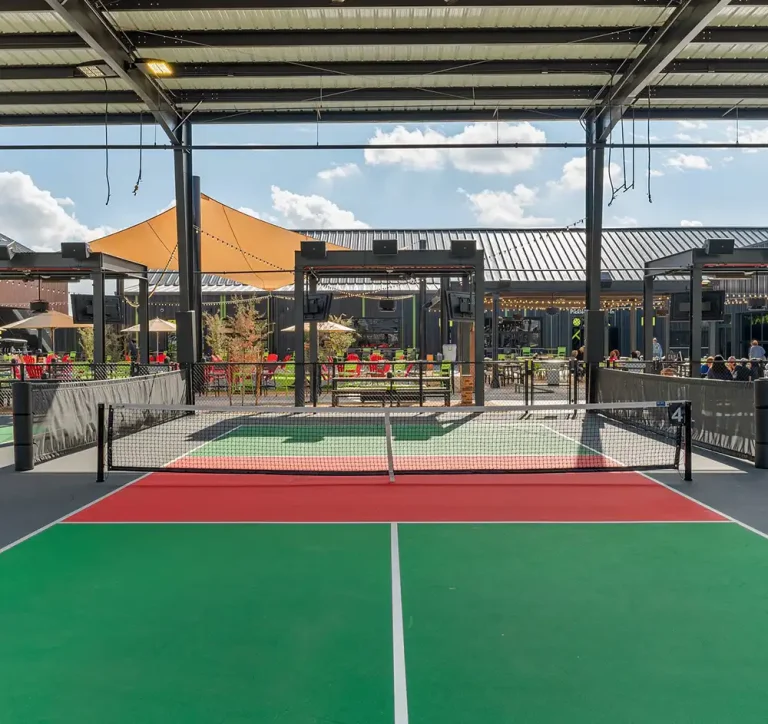 View of one of the courts and amenities at Chicken N Pickle Pickleball Courts in Glendale Arizona